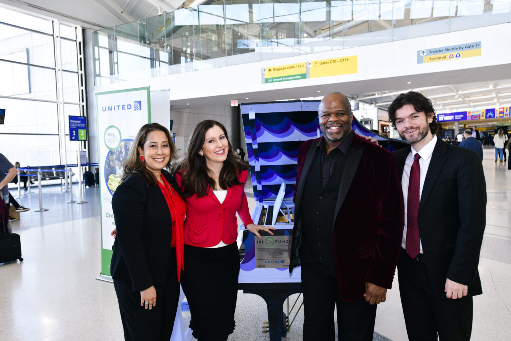 Sing for Hope Co-Founders Monica Yunus and Camille Zamora join Sing for Hope Artist Partners Lester Lynch and Chris Piro at the inauguration of one of two new Sing for Hope Pianos at Newark Liberty International Airport’s United Terminal C.